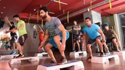 People participating in a group fitness training session at a Madurai gym.